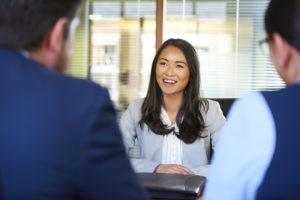 physician-candidate-asking-questions-while-on-a-job-interview-with-medical-practice