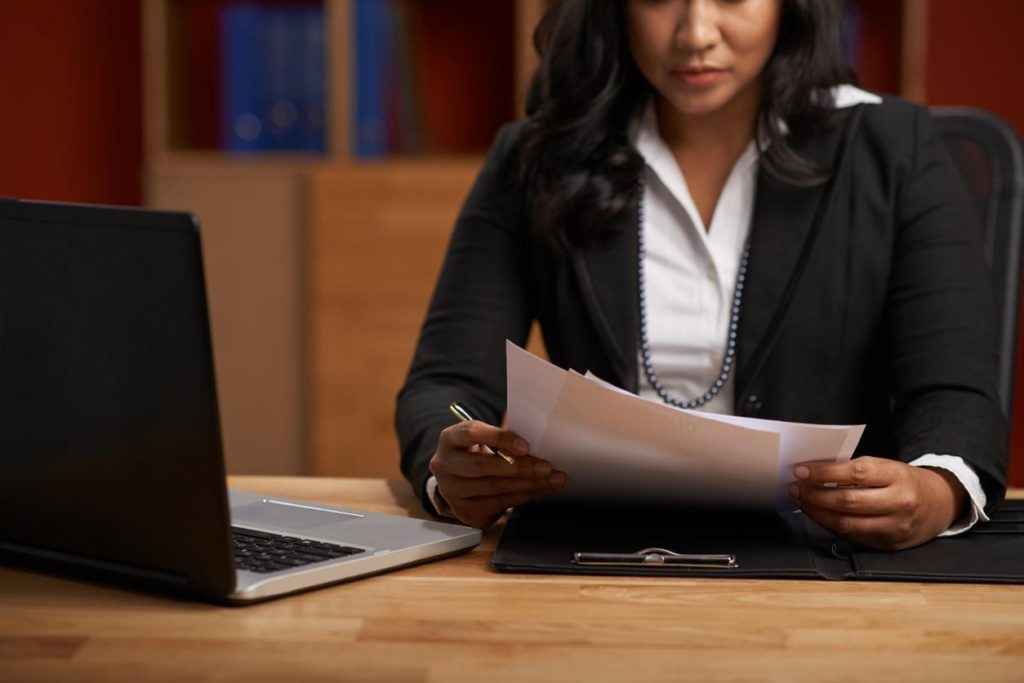 physician-employment-contract-lawyer-reviewing-contract-at-desk