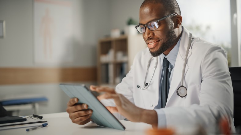 physician-conducting-research-before-deciding-on-job-hire