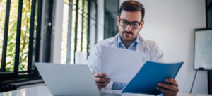 Physician reviewing a job offer including salary, benefits, and more factors