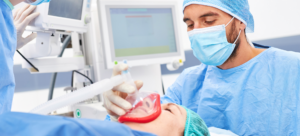 An anesthesiologist administering anesthesia to a patient