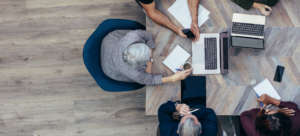 Medical employers at a practice or hospital system creating a physician job offer and discussing how to make it more attractice
