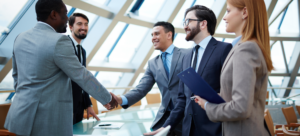 Physician and Medical employers shaking hands as they agree on a physician contract