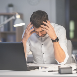 Frustrated physician who is stressed because they waited too long to begin their job search