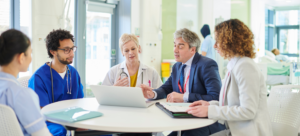 medical employers discussing how they can improve their physician recruiting and retention