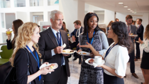 A group of physicians networking with one another during a break in a medical conference for their specialty.