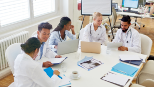Group of physicians searching online for jobs across the country