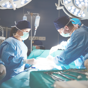 Physicians performing surgery in an operating room