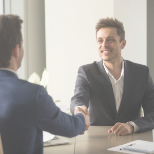a doctor shaking the hand of their new employer after accepting a job offer
